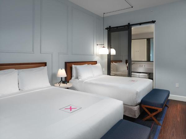 Axiom Hotel : photo 1 de la chambre chambre lit queen-size premium avec 2 lits queen-size