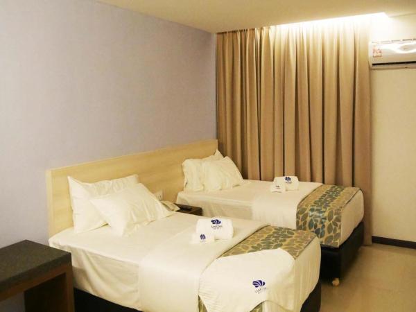 Samudra Hotel Kuching : photo 1 de la chambre chambre lits jumeaux