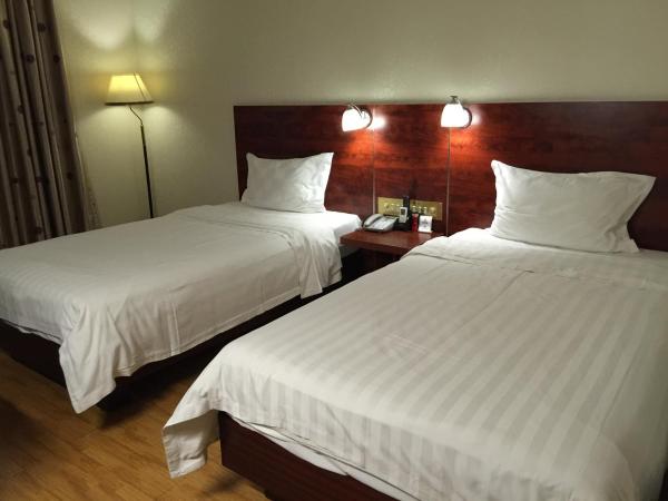 Guang Dong Hotel : photo 4 de la chambre chambre lits jumeaux standard