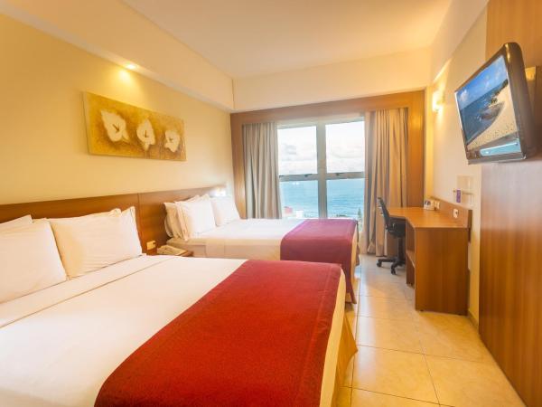 Praiamar Express Hotel : photo 2 de la chambre chambre supérieure avec 2 lits doubles - vue sur mer