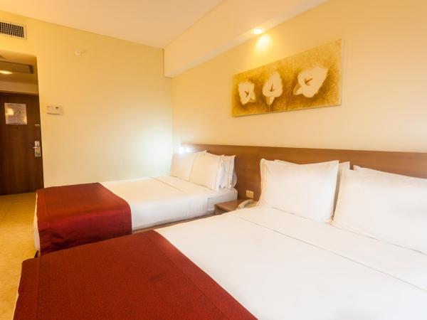 Praiamar Express Hotel : photo 9 de la chambre chambre standard avec 2 lits doubles