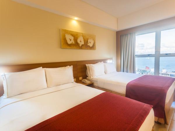 Praiamar Express Hotel : photo 3 de la chambre chambre supérieure avec 2 lits doubles - vue sur mer