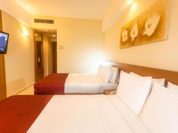Praiamar Express Hotel : photo 10 de la chambre chambre standard avec 2 lits doubles