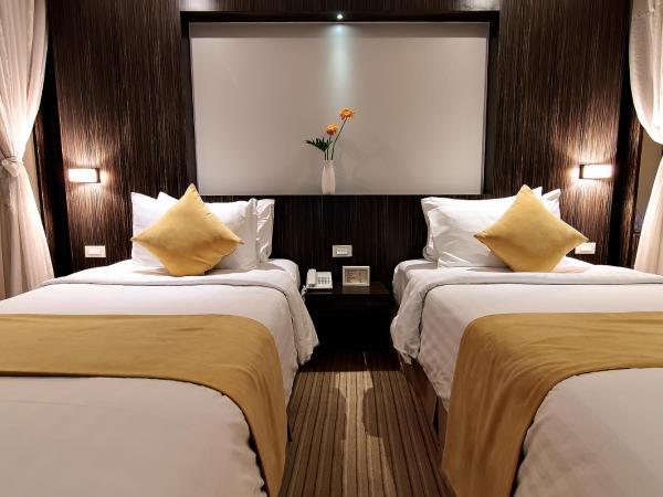 Bossotel Bangkok : photo 3 de la chambre chambre familiale avec 2 lits queen-size