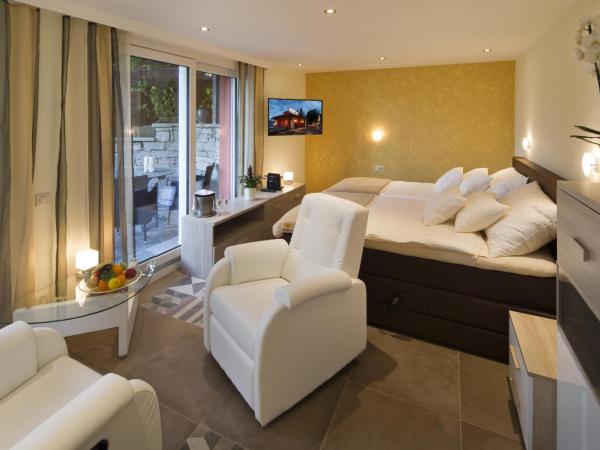 Boutique Hotel Albergo Brione : photo 2 de la chambre chambre double deluxe - vue sur jardin