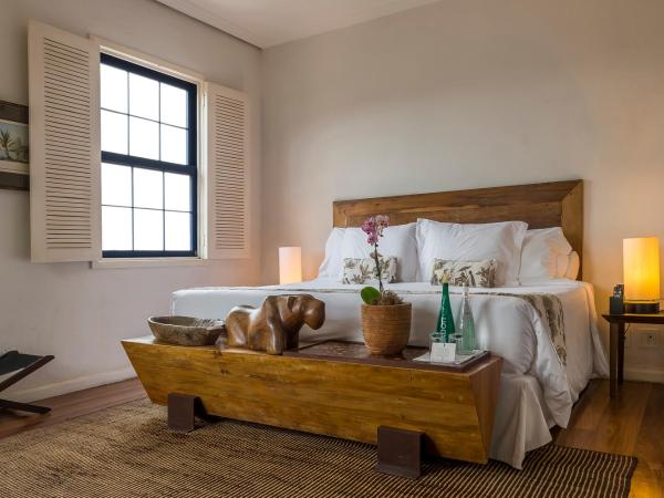 Santa Teresa Hotel RJ - MGallery : photo 1 de la chambre chambre lit king-size deluxe avec baignoire - vue sur jardin