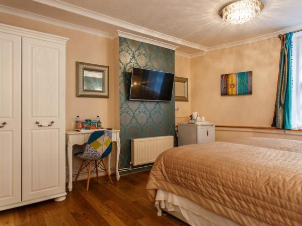 Brighton Surf Guest House : photo 2 de la chambre hébergement grand lit king-size deluxe 