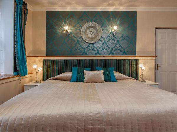 Brighton Surf Guest House : photo 1 de la chambre hébergement grand lit king-size deluxe 