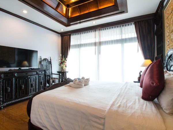 Villa Sirilanna Hotel : photo 8 de la chambre chambre lit king-size de luxe avec baignoire spa et balcon privé
