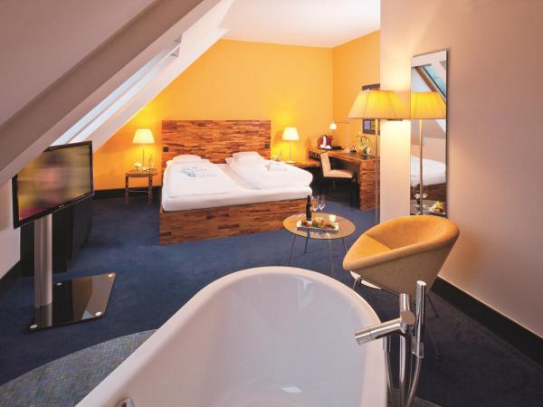 Mövenpick Hotel Berlin Am Potsdamer Platz : photo 1 de la chambre chambre lit king-size deluxe