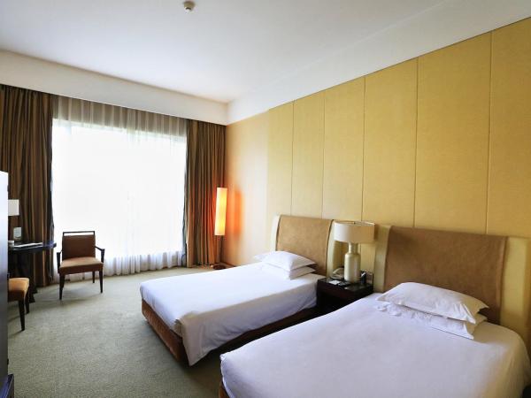 Jinling Resort Nanjing : photo 2 de la chambre chambre lits jumeaux - vue sur jardin