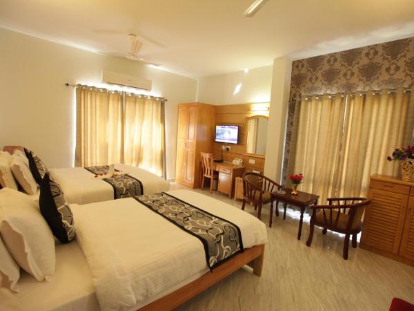Grand Cascade Chennai : photo 1 de la chambre chambre lit king-size