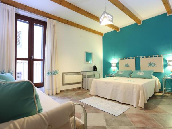 Palau De Rosa : photo 3 de la chambre chambre quadruple avec salle de bains privative