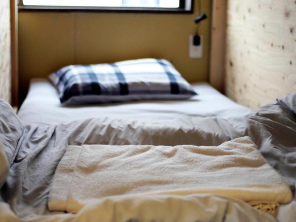 Guesthouse Sensu : photo 5 de la chambre lits superposés dans dortoir 12 lits réservé aux hommes