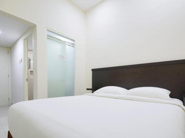 Grand Kebonsari Guesthouse : photo 8 de la chambre chambre lit king-size deluxe