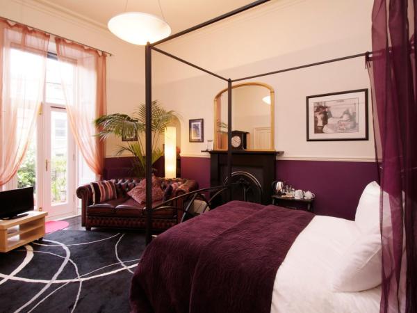 Southside Guest House : photo 7 de la chambre chambre avec lit à baldaquin