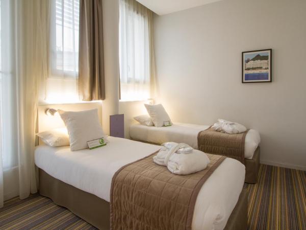 Privilège Appart Hôtel Saint Exupéry : photo 1 de la chambre appartement 1 chambre lits jumeaux - coin salon avec canapé-lit