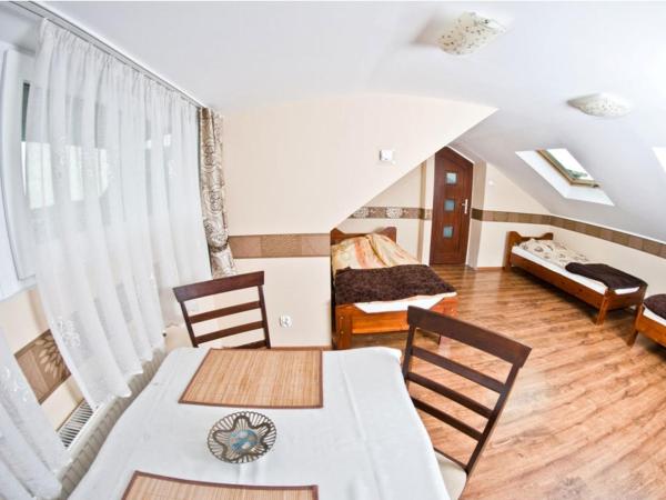 Noclegi ZŁOTA RYBKA : photo 2 de la chambre chambre quadruple