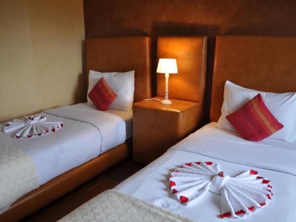 Riad Hamdani : photo 5 de la chambre chambre triple - vue sur jardin