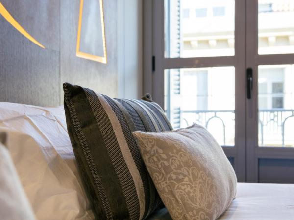 Legazpi Doce Rooms & Suites : photo 1 de la chambre appartement 1 chambre avec balcon