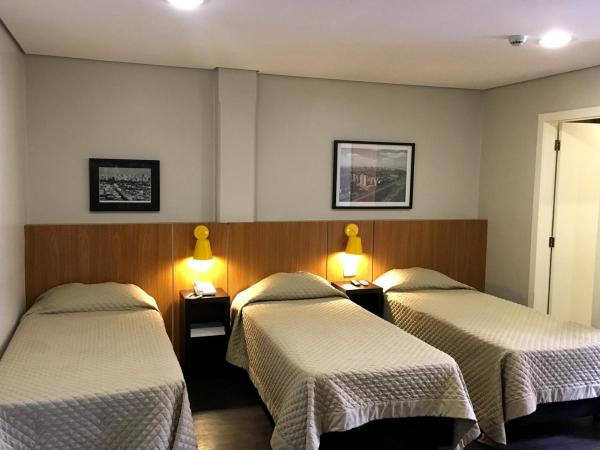 Hotel Grand Barão : photo 1 de la chambre chambre triple