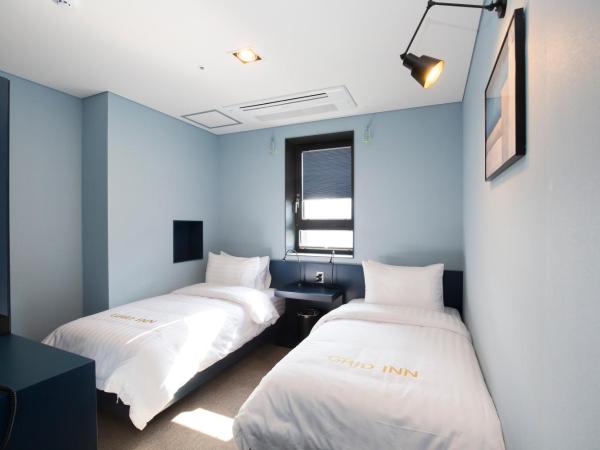 Grid Inn Hotel : photo 3 de la chambre chambre lits jumeaux