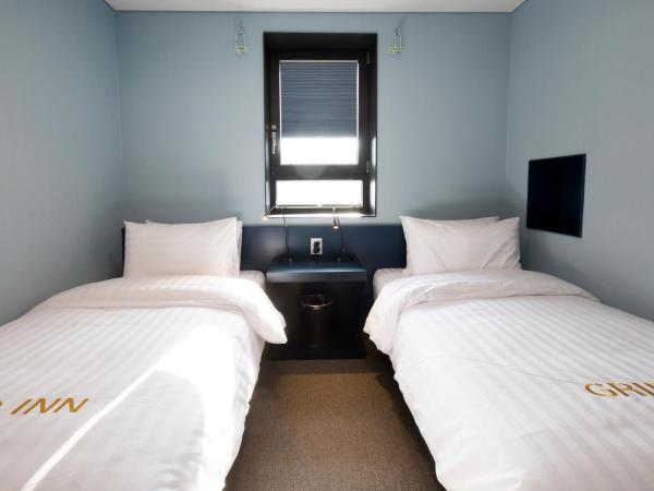 Grid Inn Hotel : photo 1 de la chambre chambre lits jumeaux