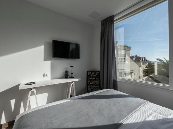 Suite Home Sardinero : photo 2 de la chambre chambre standard lit queen-size