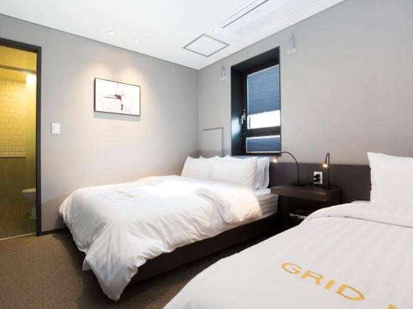 Grid Inn Hotel : photo 3 de la chambre chambre triple