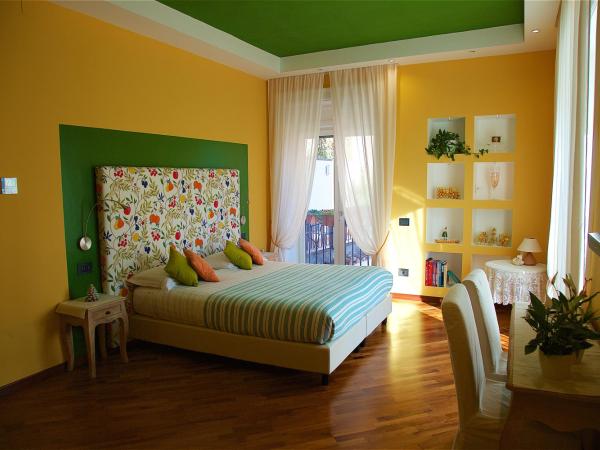 Il Giardino Segreto : photo 5 de la chambre chambre double ou lits jumeaux supérieure - vue sur jardin