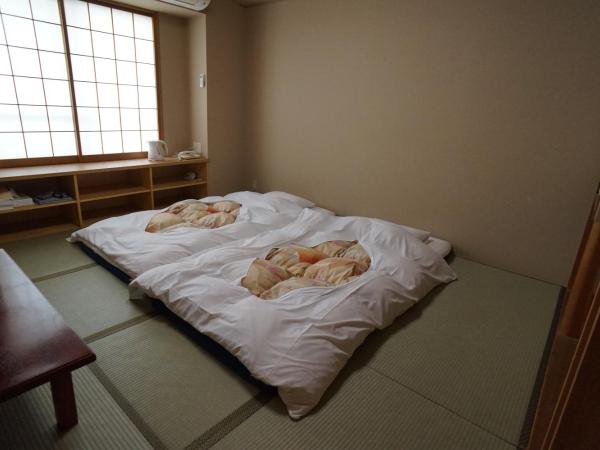 Annex Katsutaro Ryokan : photo 3 de la chambre chambre lits jumeaux deluxe de style japonais