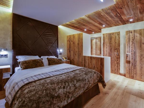 Hôtel-Chalet Les Ecureuils Restaurant, Sauna & Spa Garage : photo 1 de la chambre suite avec balcon