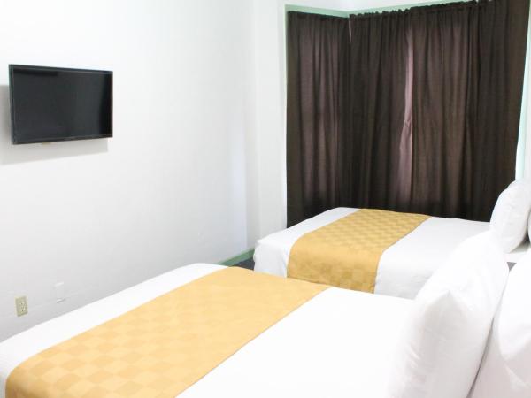 Union Hotel : photo 6 de la chambre chambre de luxe avec 2 lits doubles et salle de bains commune