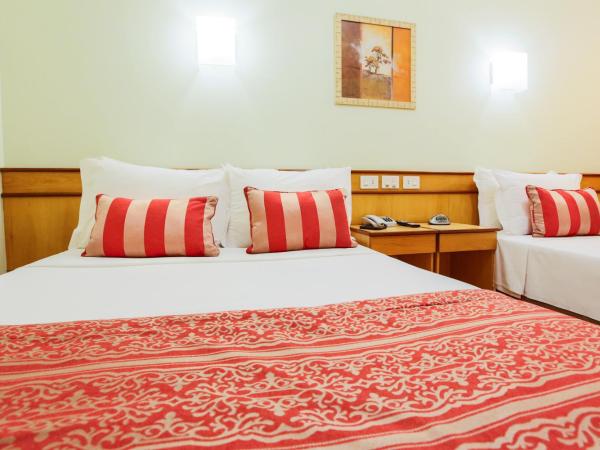 Scorial Rio Hotel : photo 7 de la chambre chambre triple de luxe (1 lit double + 1 lit simple)