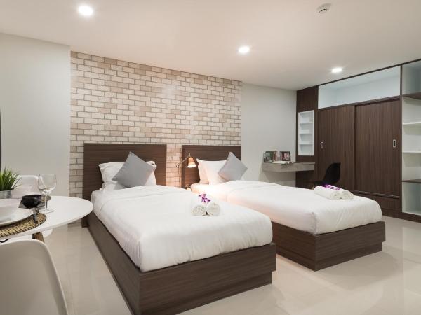 Q Space Residence : photo 5 de la chambre chambre quadruple avec balcon 