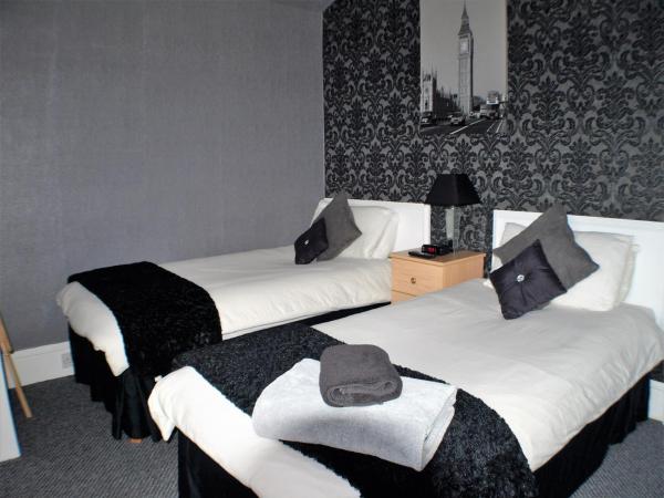 Vaila Guest House : photo 1 de la chambre chambre lits jumeaux avec douche et toilettes communes