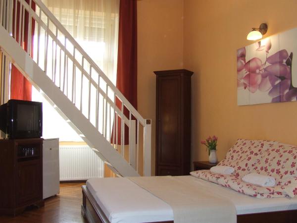 Péterfia Panzió : photo 9 de la chambre chambre quadruple en duplex