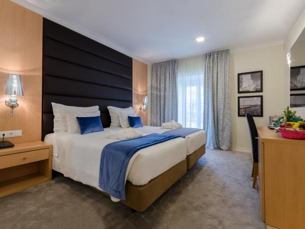 Hotel INN Rossio : photo 3 de la chambre chambre quadruple