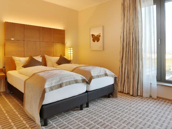 Hotel TheGreen ehemals Köln11 : photo 6 de la chambre deluxe dopplezimmer mit aussicht auf den golfplatz