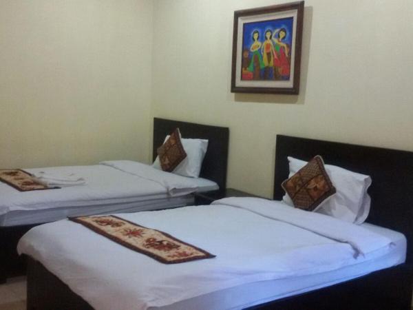 Alam Jogja Resort Mitra RedDoorz : photo 8 de la chambre chambre lits jumeaux