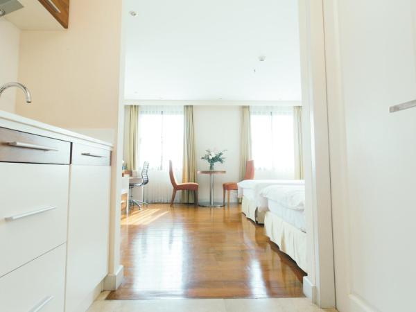 Thomson Residence Hotel : photo 3 de la chambre chambre lits jumeaux deluxe