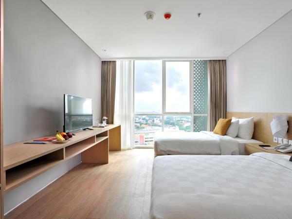 Midtown Residence Surabaya : photo 2 de la chambre hébergement lits jumeaux fabulous