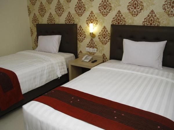 Hersya Front One Inn Surabaya : photo 4 de la chambre chambre lits jumeaux supérieure