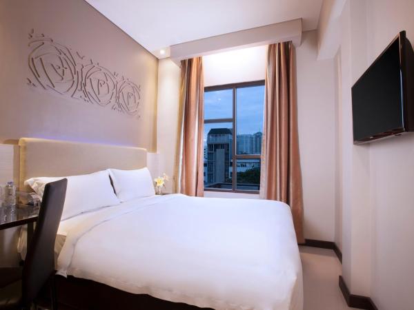 Verse Lite Hotel Gajah Mada : photo 1 de la chambre chambre deluxe double ou lits jumeaux
