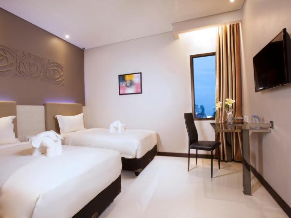 Verse Lite Hotel Gajah Mada : photo 2 de la chambre chambre deluxe double ou lits jumeaux