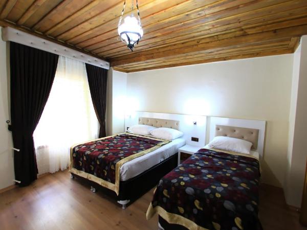 Bacchus Pension : photo 1 de la chambre chambre triple supérieure