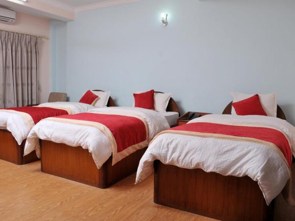 Hotel Brihaspati : photo 4 de la chambre chambre triple deluxe