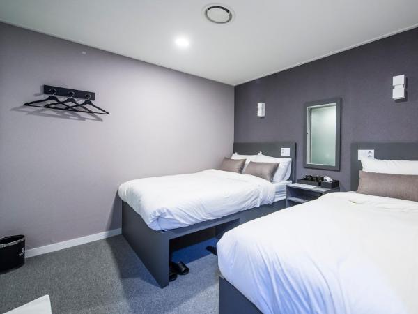 Philstay Myeongdong Metro : photo 1 de la chambre chambre triple