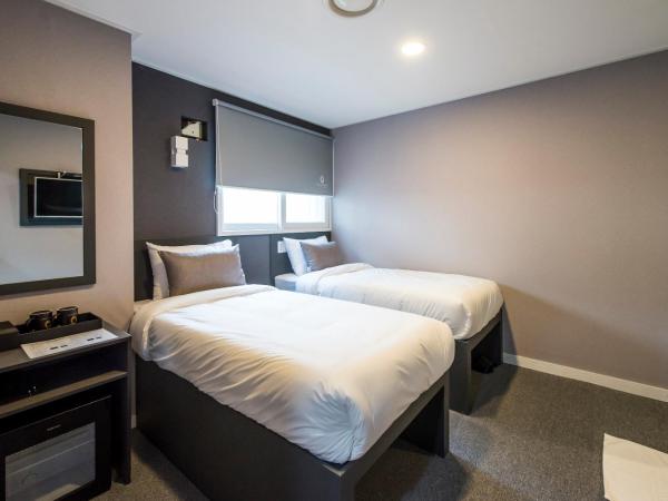 Philstay Myeongdong Metro : photo 1 de la chambre chambre lits jumeaux
