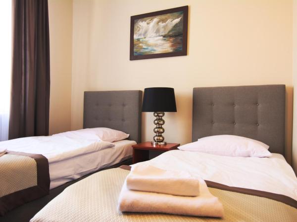 Centrum Konferencyjno-Apartamentowe Mrówka : photo 1 de la chambre chambre lits jumeaux